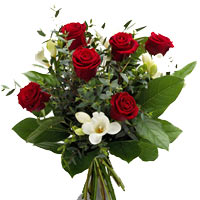 A classically inspired bouquet of red roses contrasted by bright white blooms an...