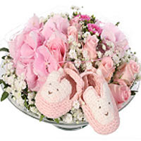 A cute decoration for a baby girl with lovely pink slippers. The decoration is m...