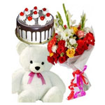 Divine Bouquet of Roses with Cuddly Teddy and Delectable Black Forest Cake