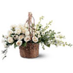 This delicate wicker basket filled with beautiful white flowers will surely spre...