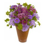 A mystical bouquet of lavender roses, chrysanthemums and asters presented in a c...