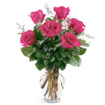 Tickle her pink with a vase of vibrant pink roses.

...
