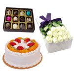 Pretty White roses, a Box of Chocolates with a Fruit Cake