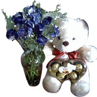 1 dozen blue roses in a vase w/ bear n chocolates