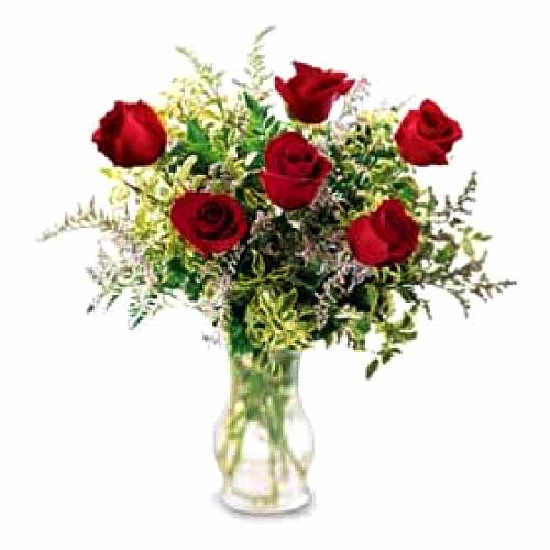 6 pcs red roses w/ greenary in a glass vase
