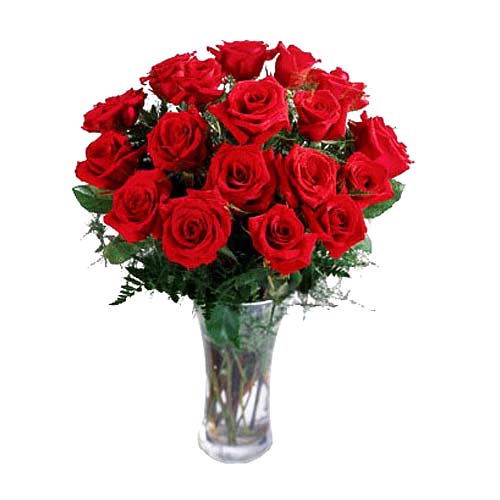 18 Roses artfully arranged in a glass vase with gr......  to Oroquieta