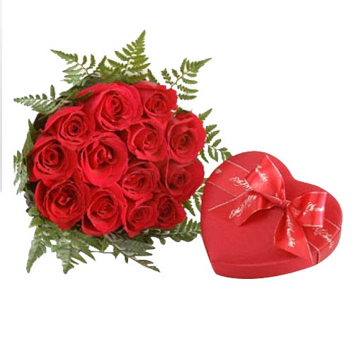 One dozen red roses in a bouquet with heart shape ......  to Valencia
