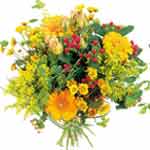 Posy bouquet of seasonal flowers, mostly in yellow...