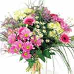 Posy bouquet of seasonal flowers, mostly in pink c...