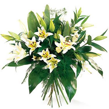 Bouquet of white lilies with foliage. ...