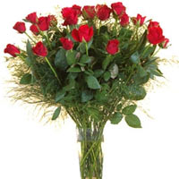 25 red roses assorted with greenery in a classic bouquet. The perfect way to cha...