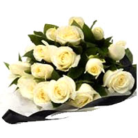 This bouquet contains 13 white roses and decorative greenery....