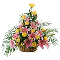 Unique flower arrangement made from pink lilies, yellow minirosa and palm leaves...