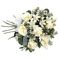 This bouquet of roses and lilies is the perfect gi...