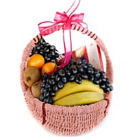This basket includes Oranges, bananas, grapes, a b...