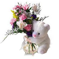 Cute Teddy Bear holding a romantic bouquet will te......  to Naberezhnye Chelny