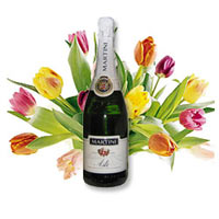 Arrangement of fresh tulips and bottle of quality ......  to Syktyvkar
