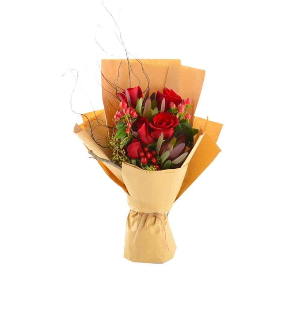 This arrangement consists of red roses decorated w...