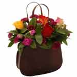 Bright Colorful Flower Arrangement in a Handbag
