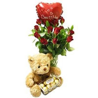  red roses in a glass vase with a cute teddy, a bo......  to Cape Town
