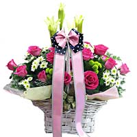 Roses with seasonal flowers in basket