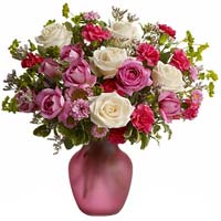 Roses with seasonal flowers with vase