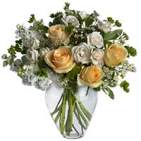 Roses with seasonal flowers with vase