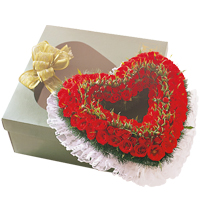 Radiant Heart Shaped Arrangement of 50 Red Roses with Green Foliage