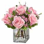 Captivating Bunch of Cerise Roses in a Small Vase