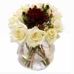 Blushing Arrangement of Red and White Roses in a Vase