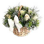 An Elegant Display Of Cream Roses, Gypsophila And Greenery In A Basket...
