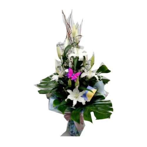 Fresh white tulips and lilies in a water vase. The......  to Lleida