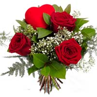 A superb example of a traditional red rose bouquet with baby's breath, lush gree...