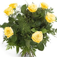 Bouquet of seven yellow roses and green. Yellow color of the flowers is said to ...