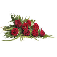 Beautiful bouquet with classic red roses and seasonal greens.<br/>Note:- Ribbon ...