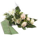A comforting mourning bouquet in soothing pastel tones where roses and lilies in...