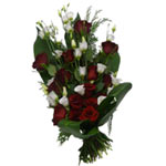 Bound funeral bouquet with red roses and vitta flowers and green.  A funeral bou...