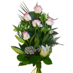 This funeral bouquet of white lily, pink roses, white alstromeria, and green. ...