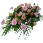 This funeral bouquet consists of pink roses,  germini, santini  and green leaves...