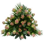 Standing funeral bouquet with pink roses. ...