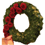 Wreath made ??from a frame of salalblad with large red roses. (Size small 50cm)....