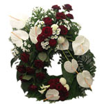 Wreath with white anthurium and red roses. A mourning wreath to express his supp...