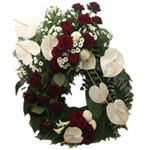 This wreath  with white anthurium, santini and red roses.(Size :- small 50cm)...