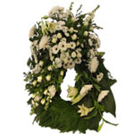 Wreath with various white flowers. A wreath of flowers mourning to pay tribute a...