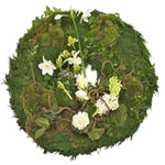 Friendship, hope and rebirth.  Funeral wreath, round stucked with white hyacinth...