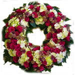 This round tied wreath bound with amalia roses, white hydrangea and astrantia. A...