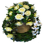 Traditional prunuskldd body with a decoration of white roses, white phalaenopsi...