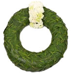 This modern funeral wreath looks simple but is rich in symbolism with two rings ...