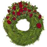  A funeral wreath that combines red roses and hypericum in a classical frame of ...