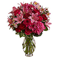 Passionate cerise pink roses, pink Asiatic lilies,...